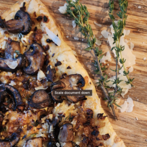 Mushroom tart on cutting board.